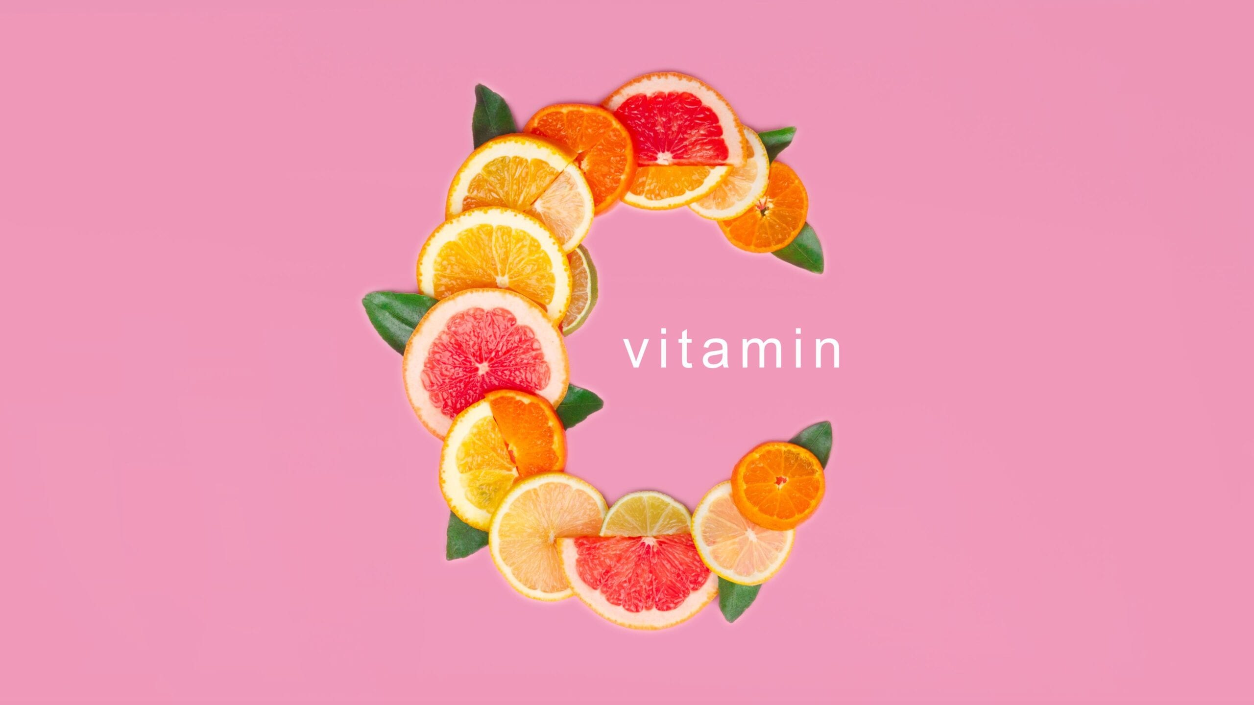Vitamin C on pink background, slice of citrus orange, lemon