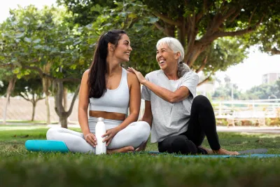 friends-doing-yoga-together-park